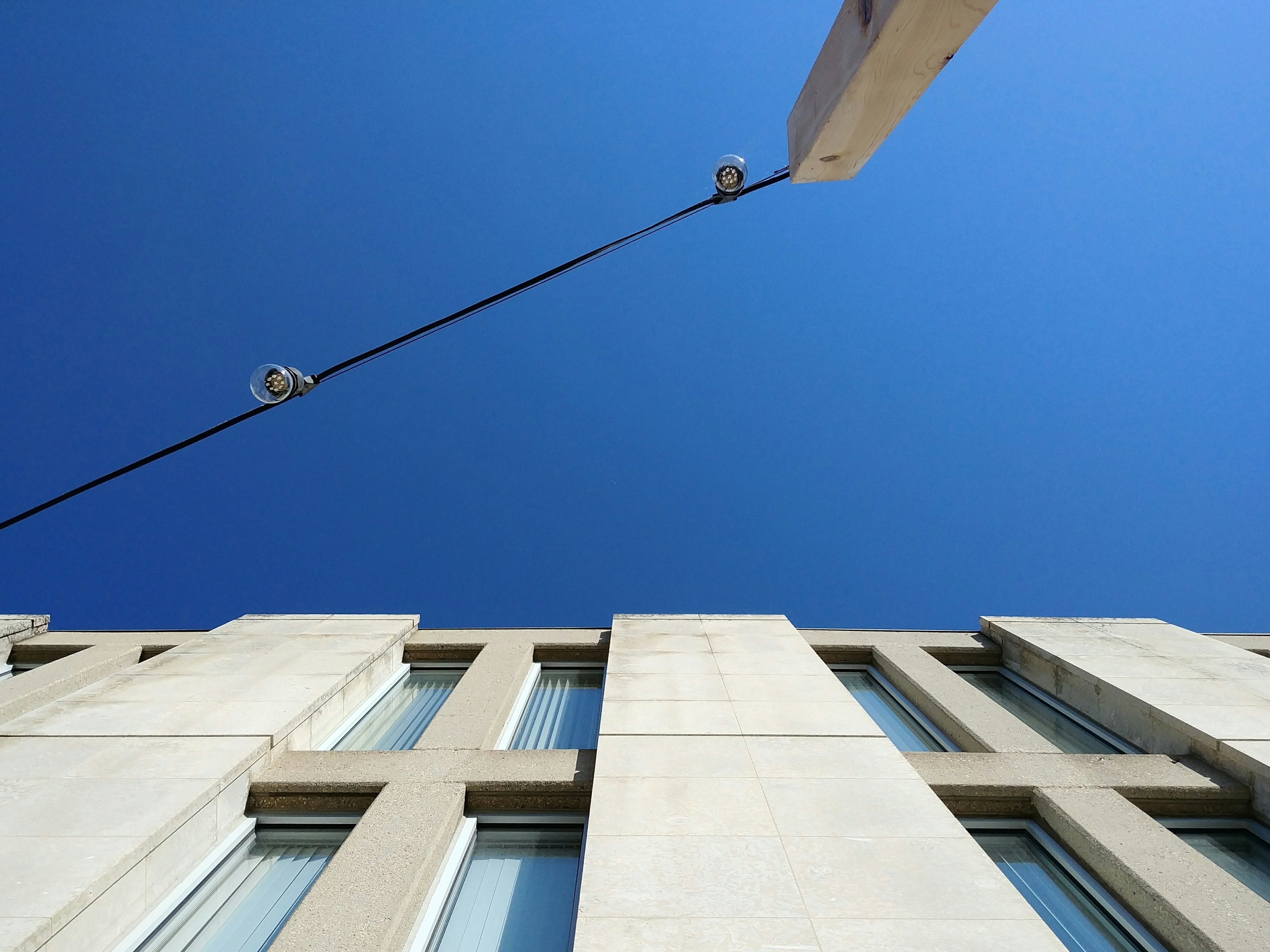 high angle photography of white concrete building under clear sky during daytime