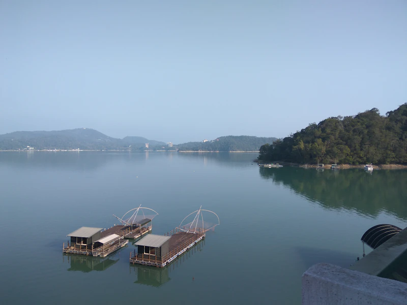 Dock on Sun Moon Lake with mountains in the background