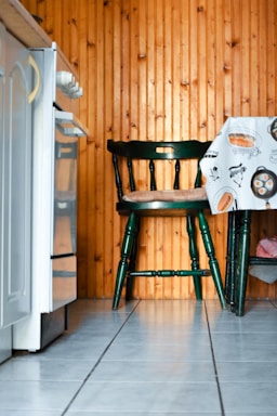 A cozy farmhouse kitchen corner featuring a wooden hutch with rustic decor.