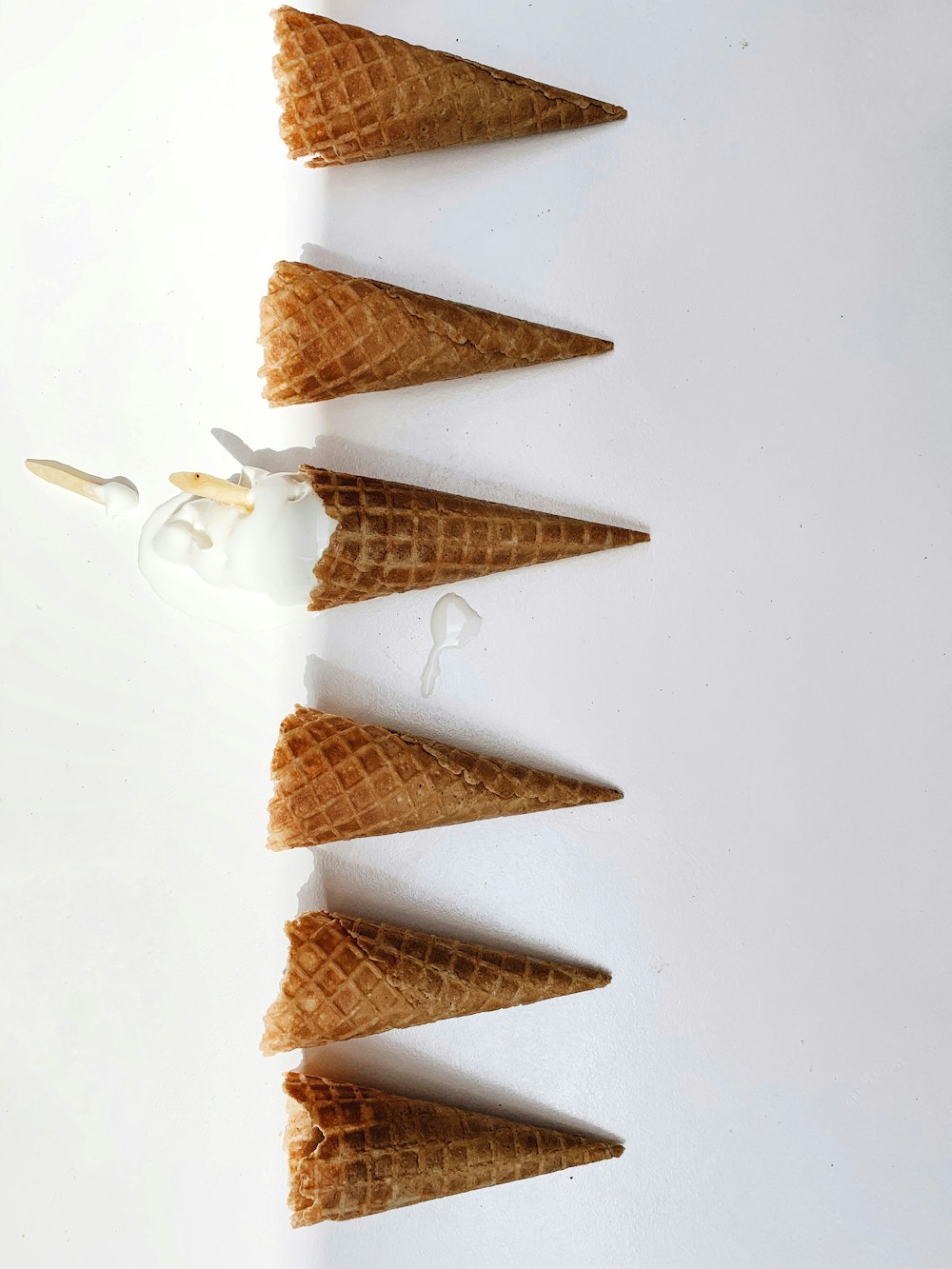 6 brown ice cream cones