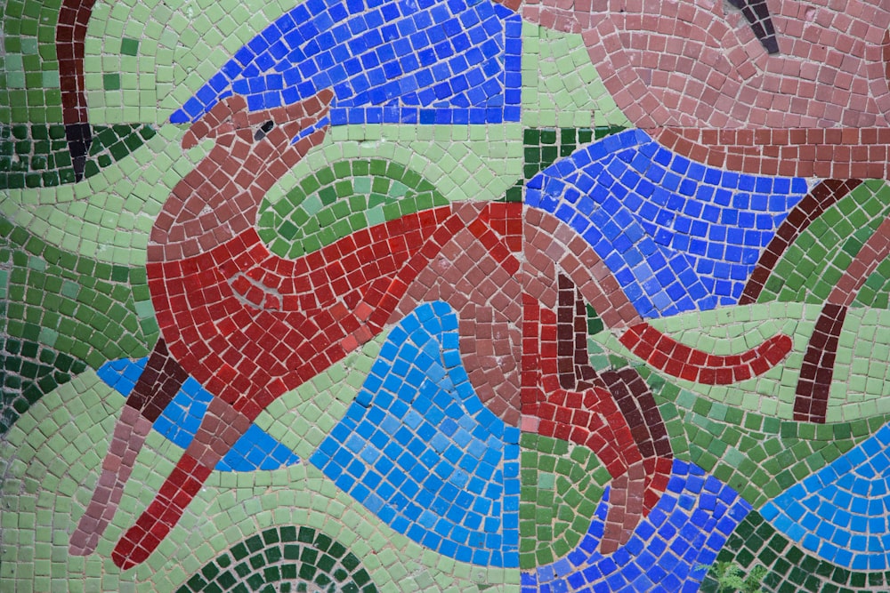 a close up of a mosaic with horses