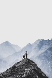 person standing on mountain peak