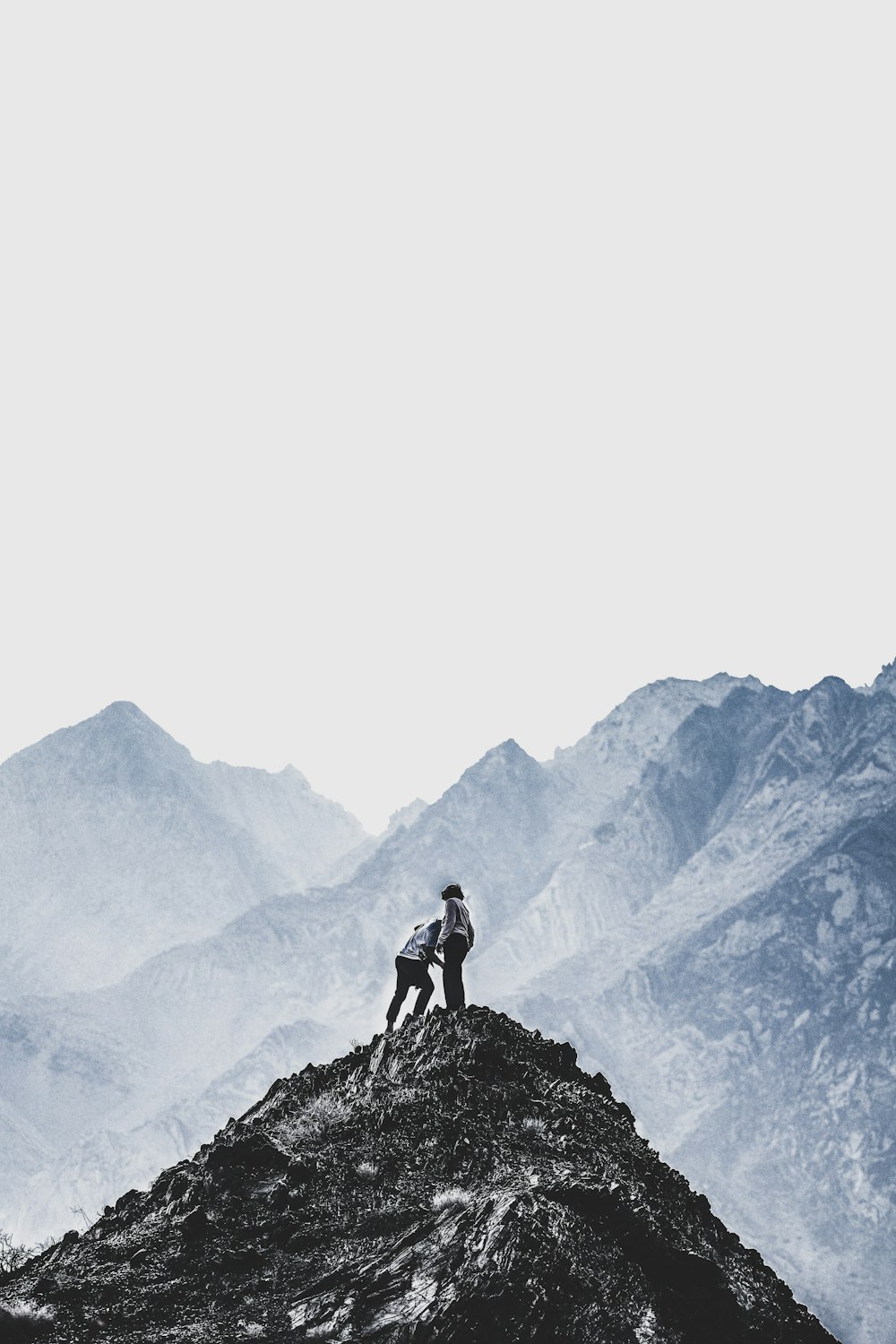 person standing on mountain peak