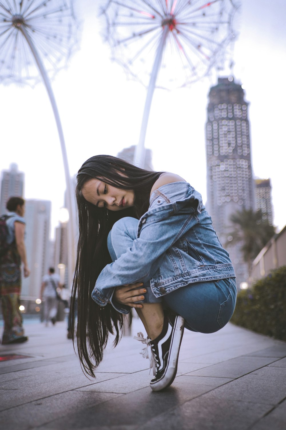 woman wearing blue denim jacket and jeans