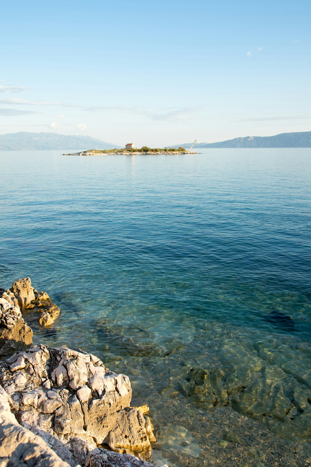 clear blue sea beside rocks