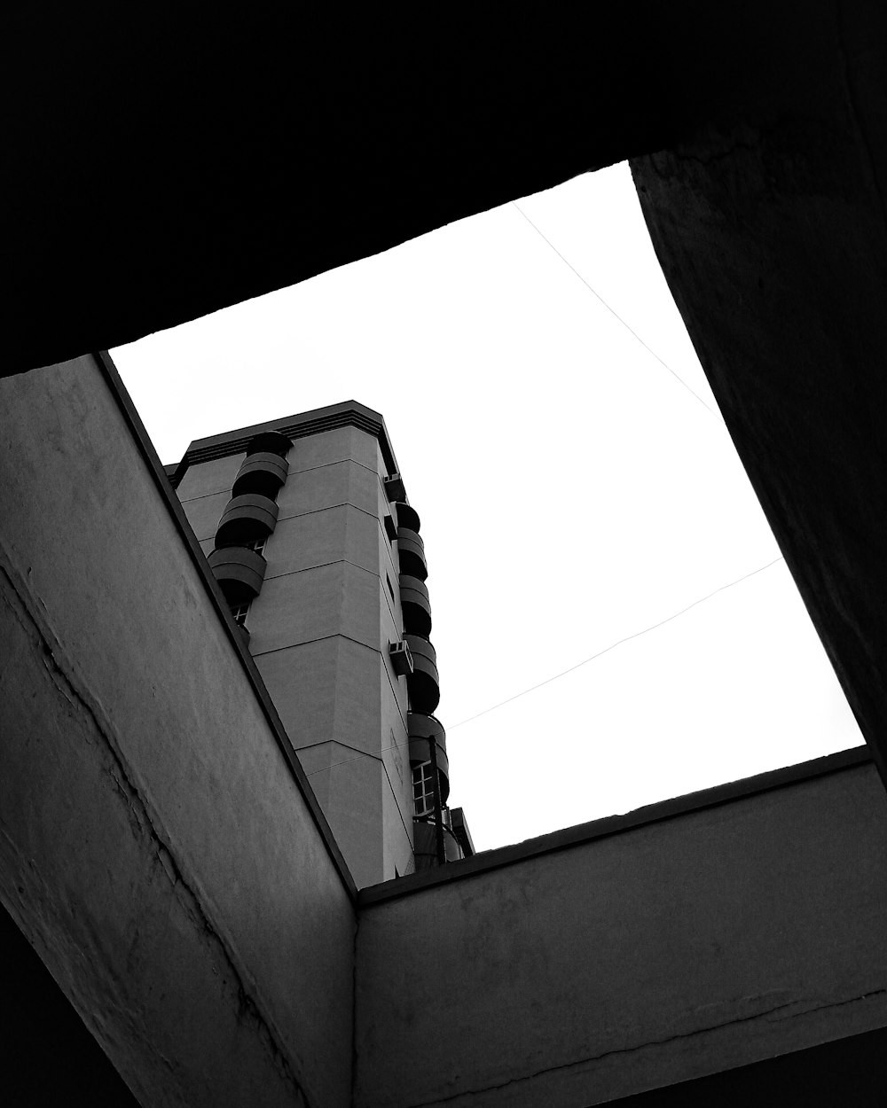 a black and white photo of a tall building