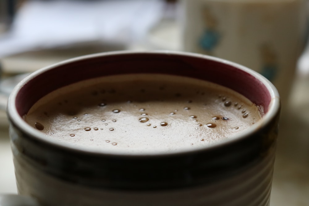 white and black ceramic mug