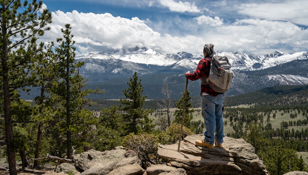 man standing on rock