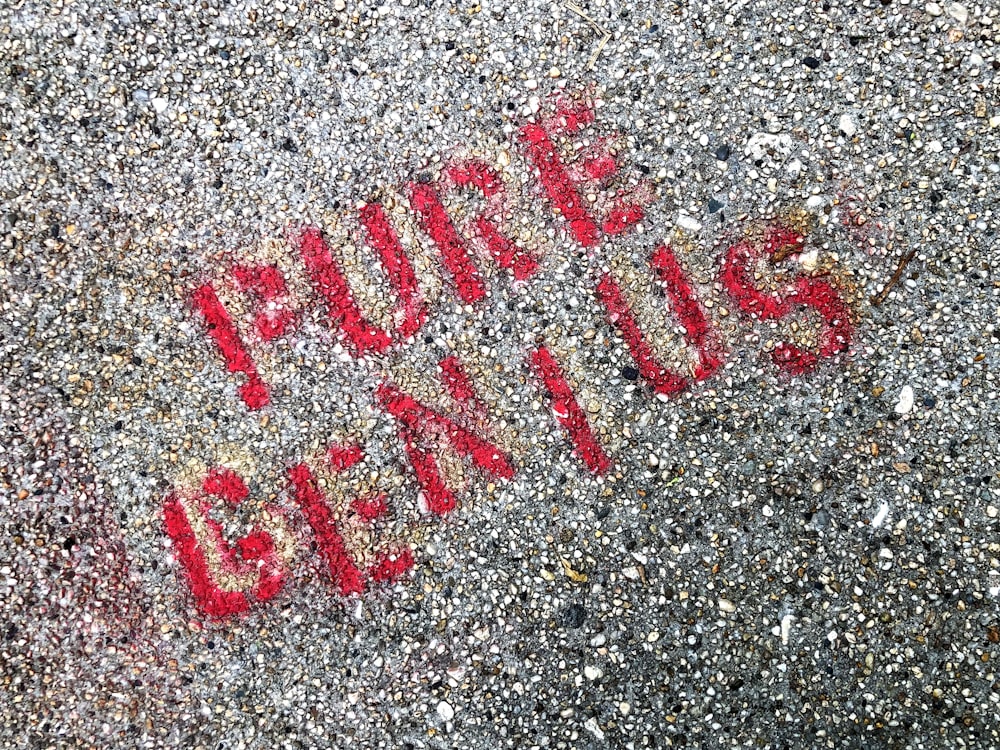 a close up of a street sign on the ground