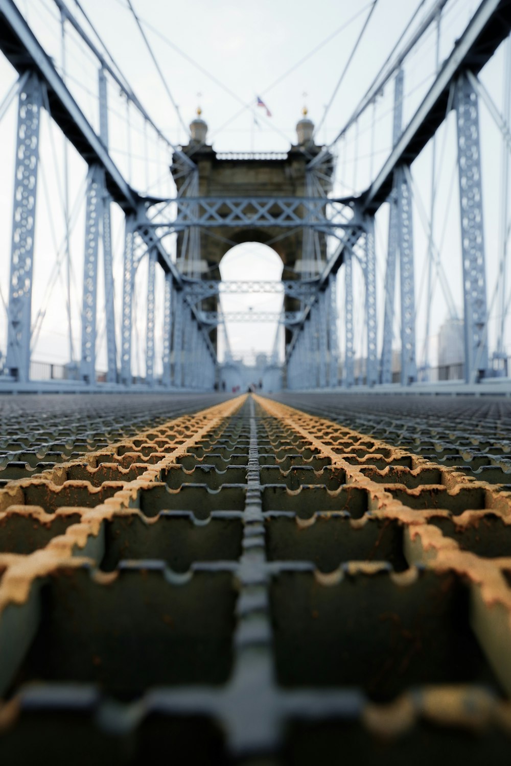 low-angle photo of white and brown bridge