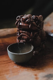 An artisan-crafted custom statue displayed in a cozy living room corner.