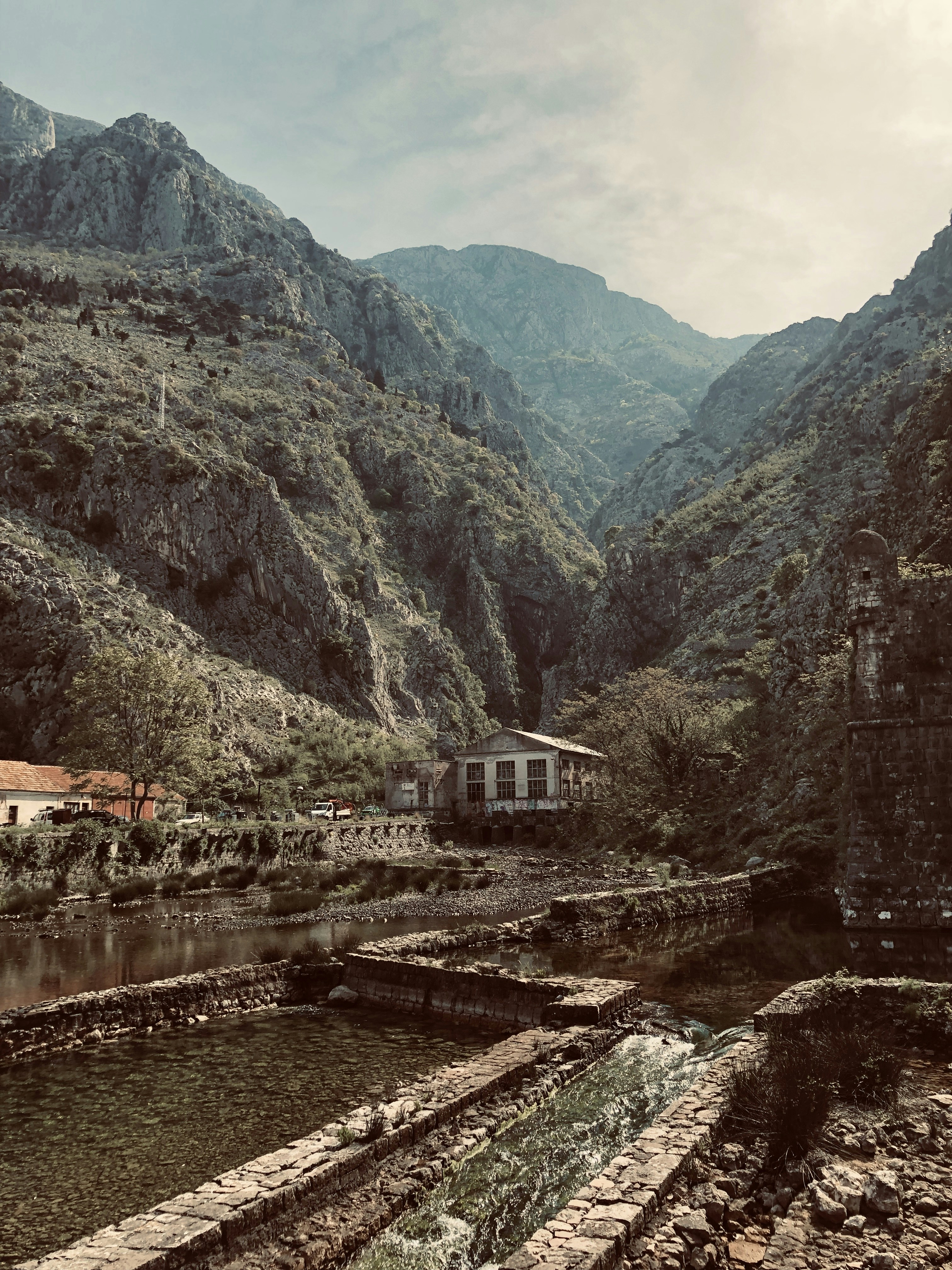 buildings near the mountains during day