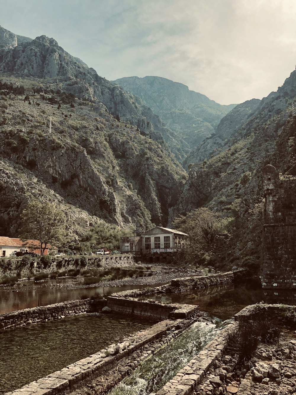 buildings near the mountains during day