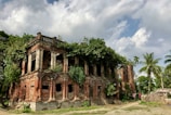 An abandoned building overtaken by nature.