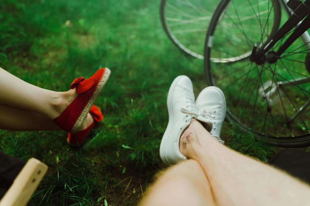 two person sitting near bicycle