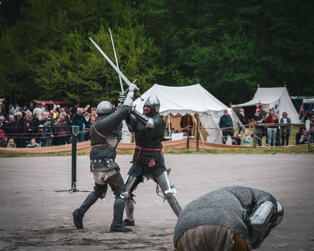 men fighting with sword,