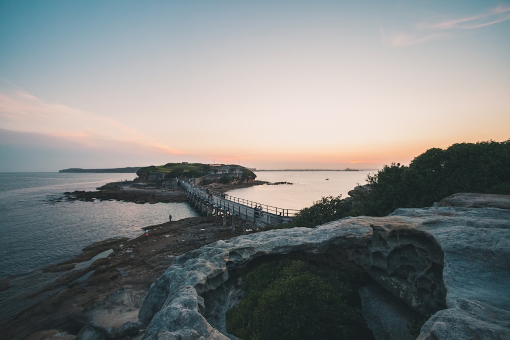 bridge on sea at golden hour