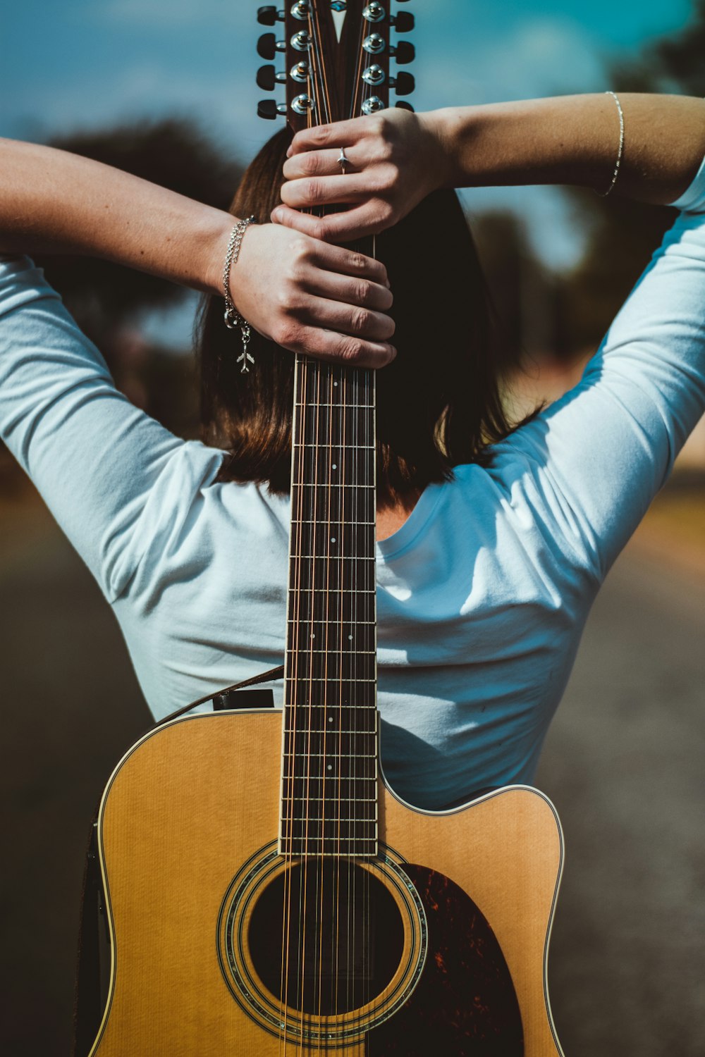 woman holding guitar