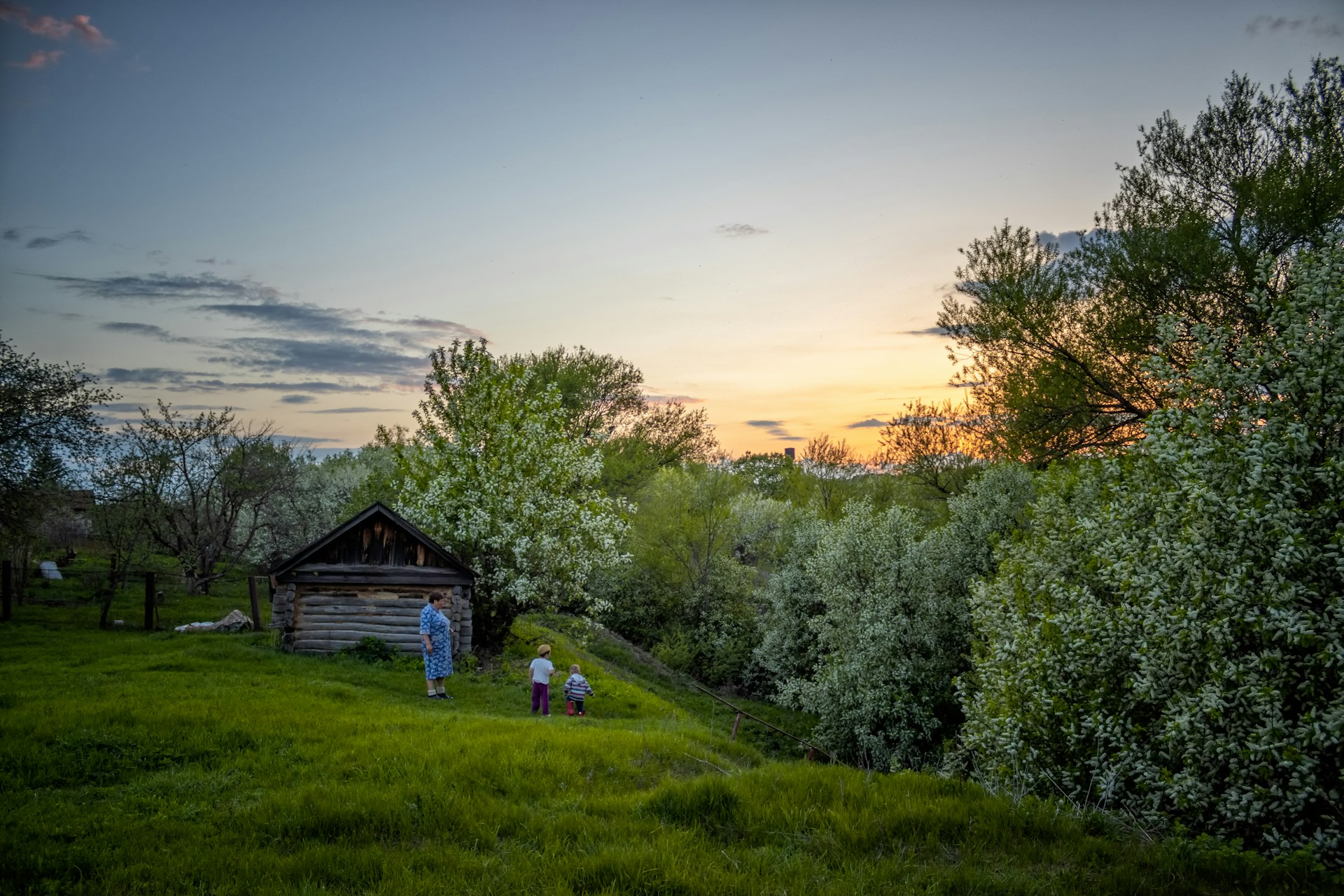 woman wearing yellow long-sleeved dress under white clouds and blue sky during daytime