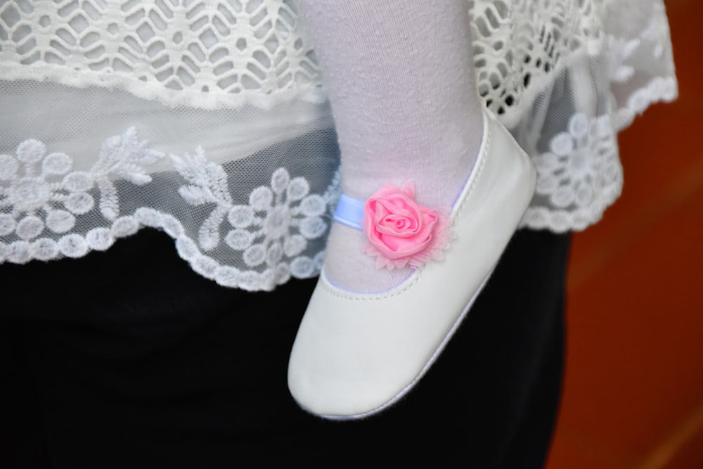 girl wearing pink and white flats