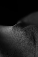 a black and white photo of a person's back