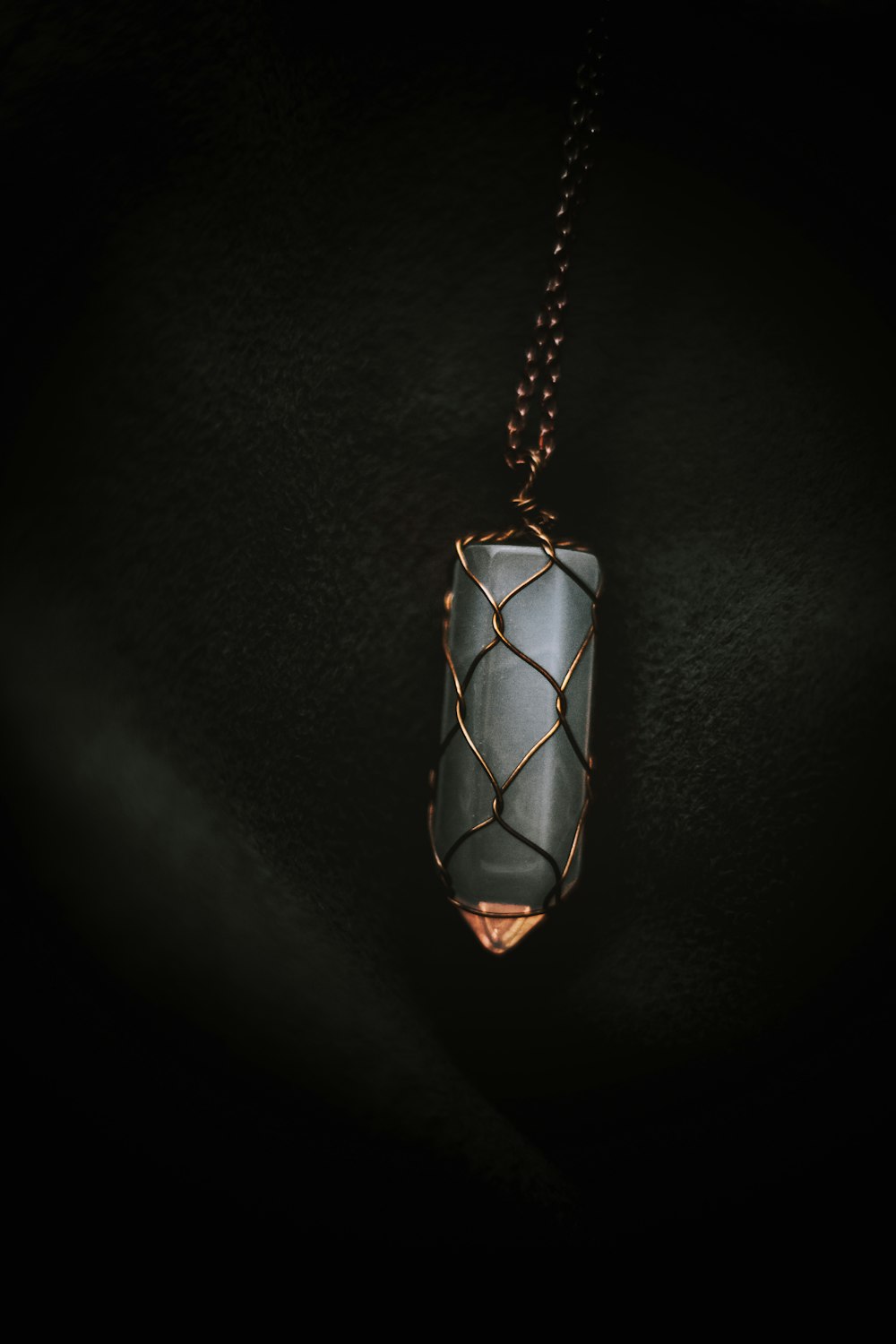 a pendant with a wire wrapped around it