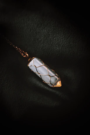 Elegant pendant necklace featuring a small wire bubble wand charm.