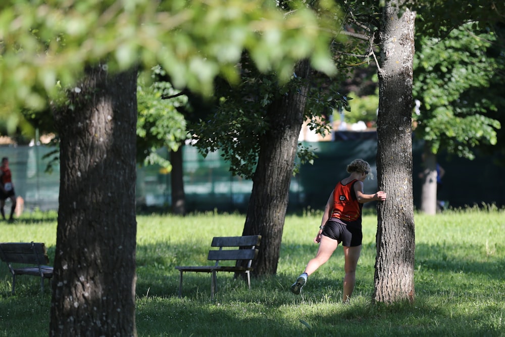 woman standing beside tree