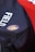 A close-up view of a bag featuring a logo with a lion and the words 'ROYALS FC'. The bag is primarily dark in color with the word 'FIELD' printed on it in white. A bright red colored background is partially visible.