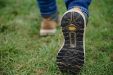 person wearing brown-and-black shoes