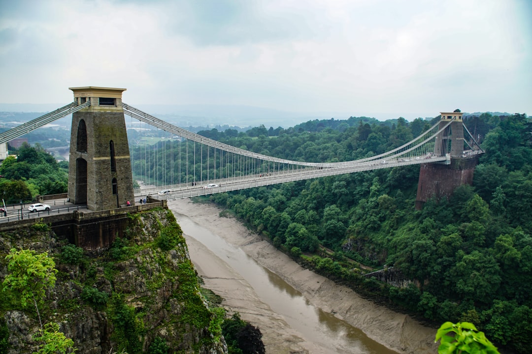 grey and brown bridge over river during daytime