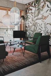 Studio KENURO’s architectural workspace: designer chairs, eclectic chandeliers, statement carpet