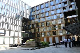 two men walking towards building