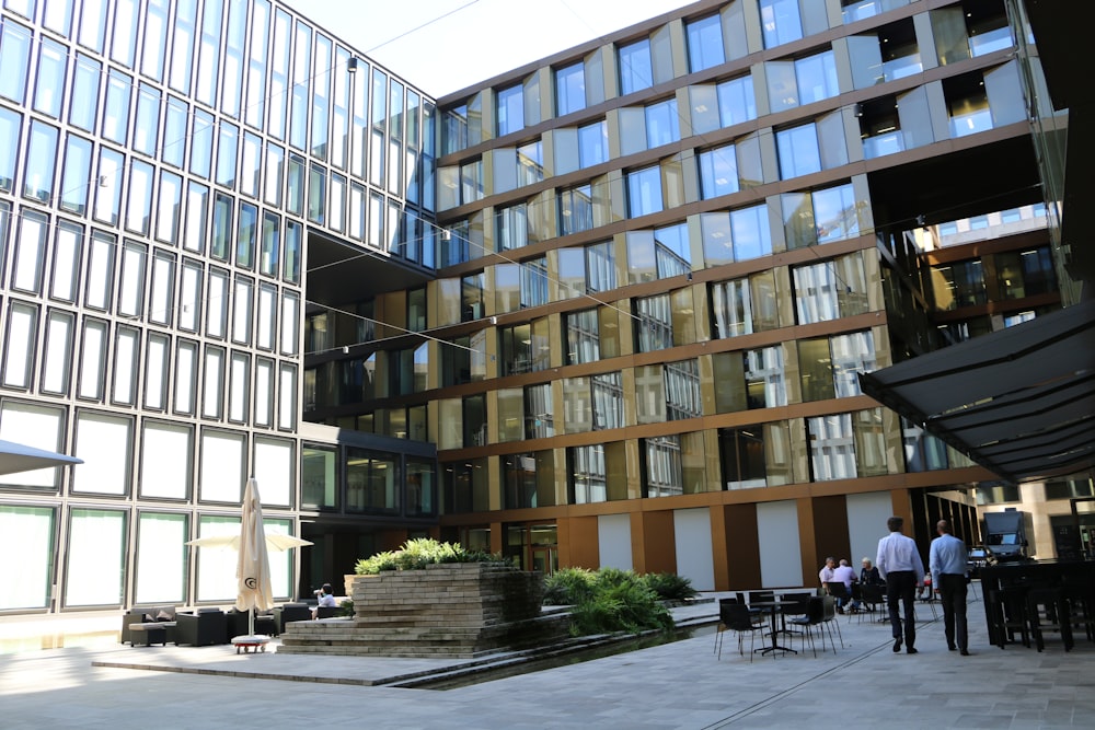 two men walking towards building