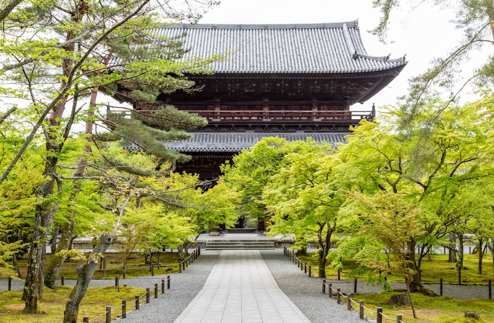 temple near green trees during daytime