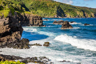 body of water crashing on rocks