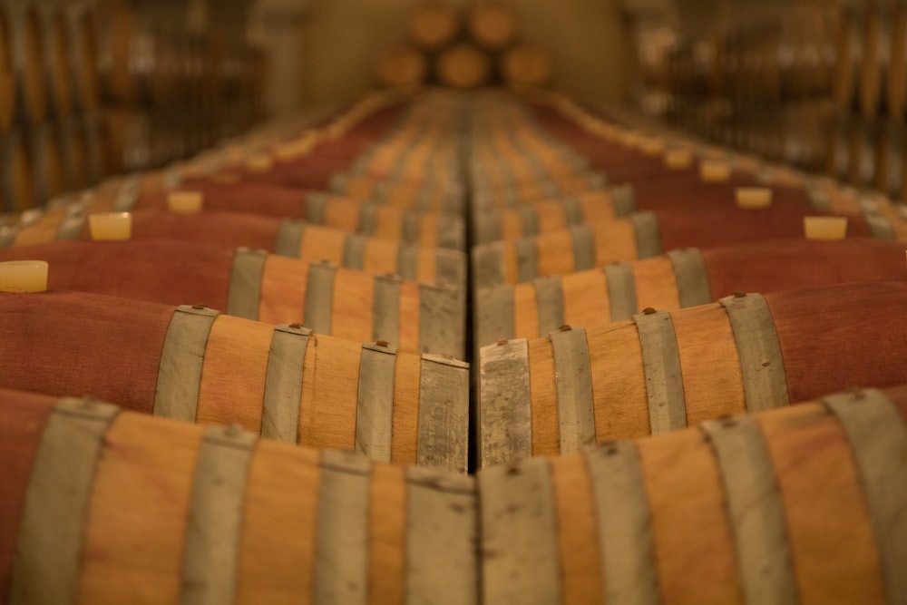 a row of wooden barrels sitting next to each other