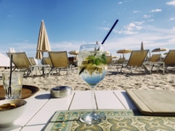 clear wine glass with black straw