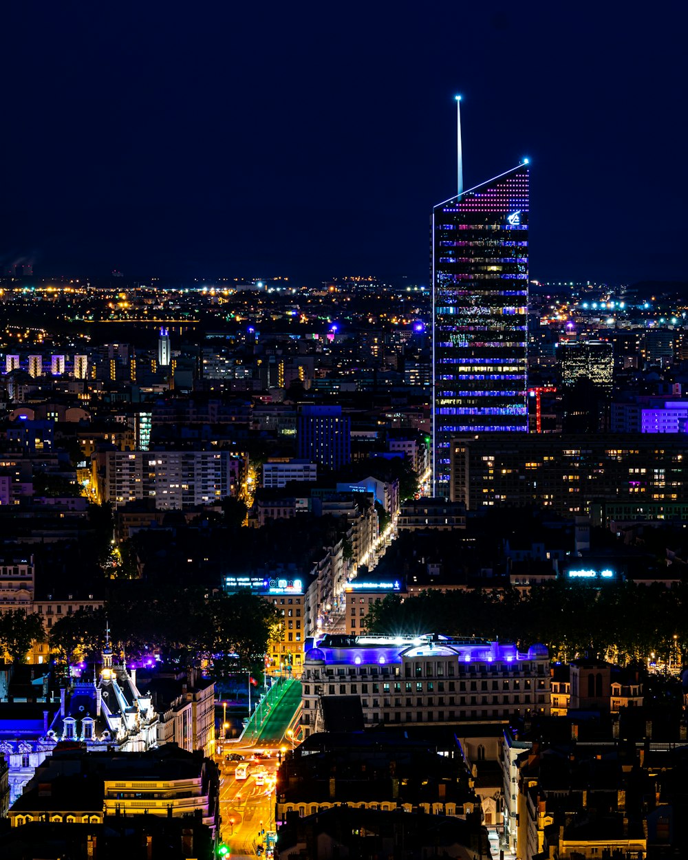 buildings with lights at night time