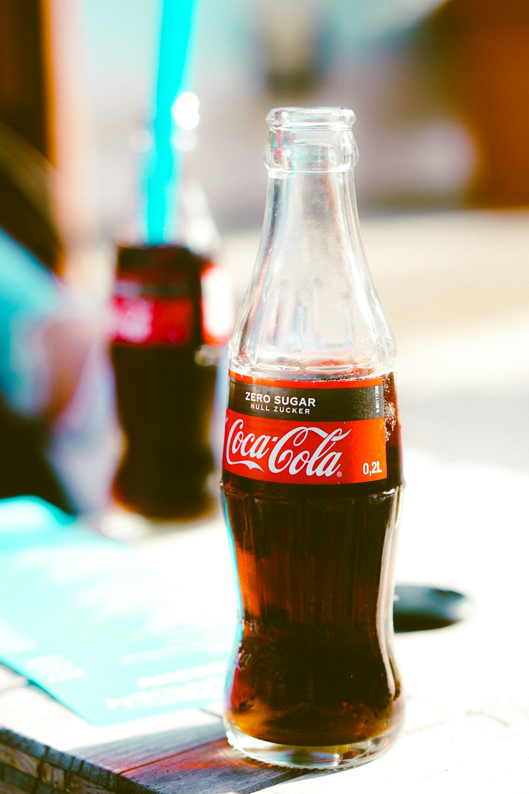 Coca-Cola soda bottle on table