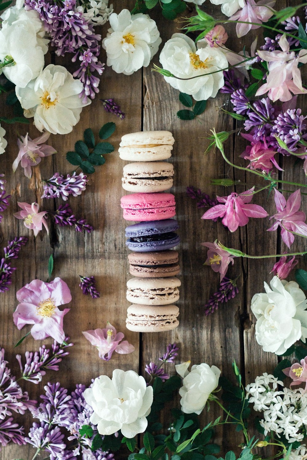 multicolored French macrons with assorted flowers