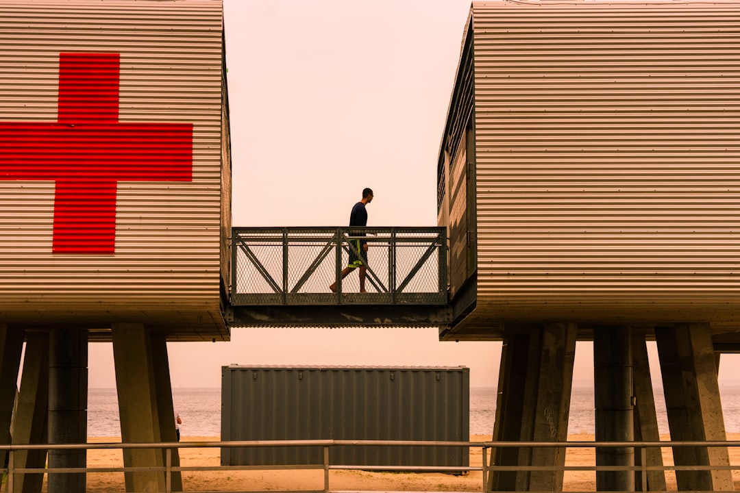 person standing on intermodal container