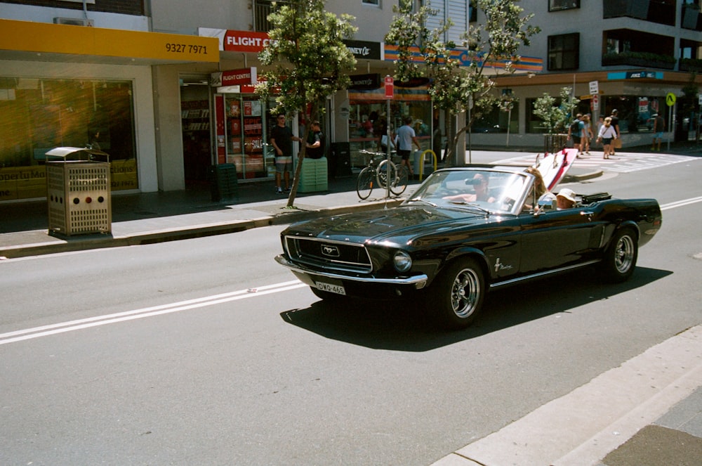 black convertible coupe on road