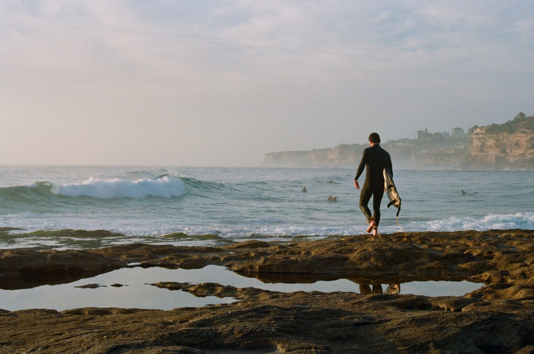 man wearing black wet suit