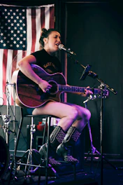 woman playing guitar\