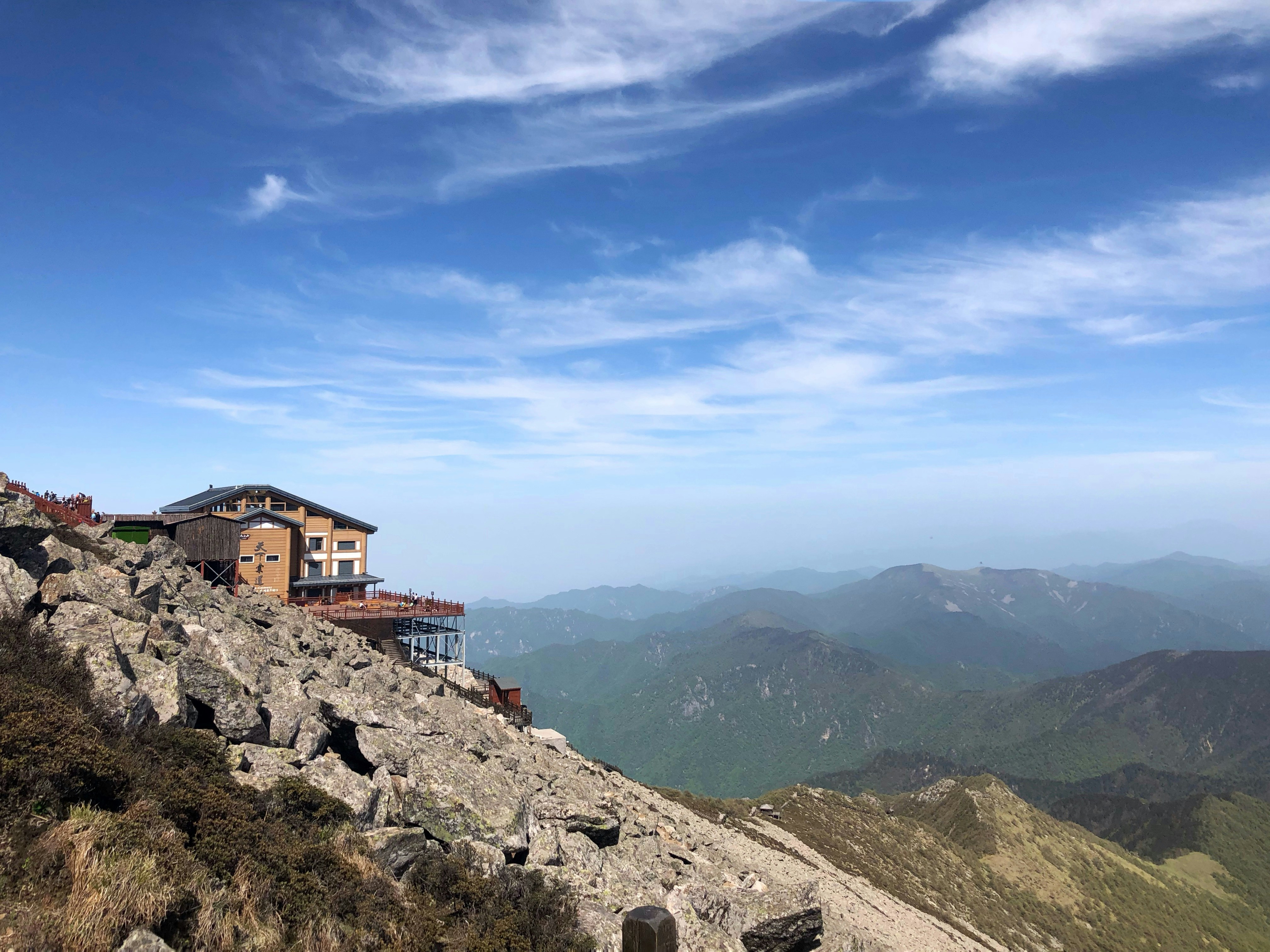 brown house on cliff during daytime