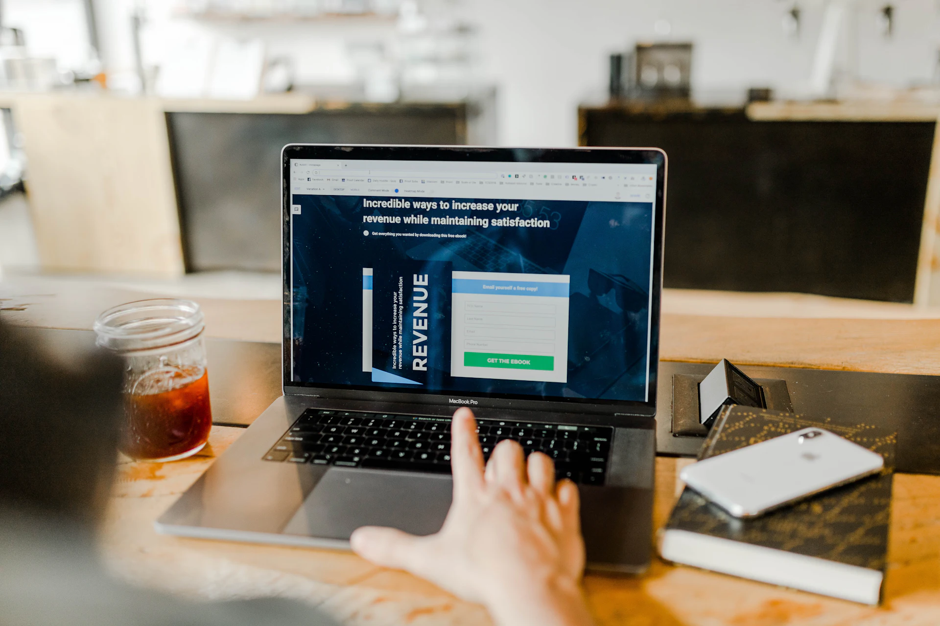 A handwritten ledger and pen on a desk, representing tracking debts and payments