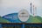 A prominently displayed SeaWorld San Diego sign with a circular logo. The background is a mix of blue and green hues, and the sign reads 'Thank You For Your Support' with an emphasis on saving animals. Colorful flags in blue, orange, and green are flying in the background.