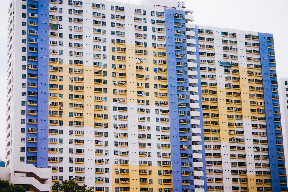 two white-and-yellow concrete buildings