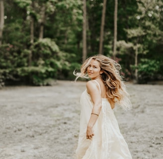 woman wearing dress beside tree